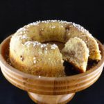 picture of a round sugar cake with two slices cut out