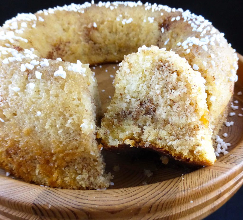 picture of a round sugar cake with two slices cut out