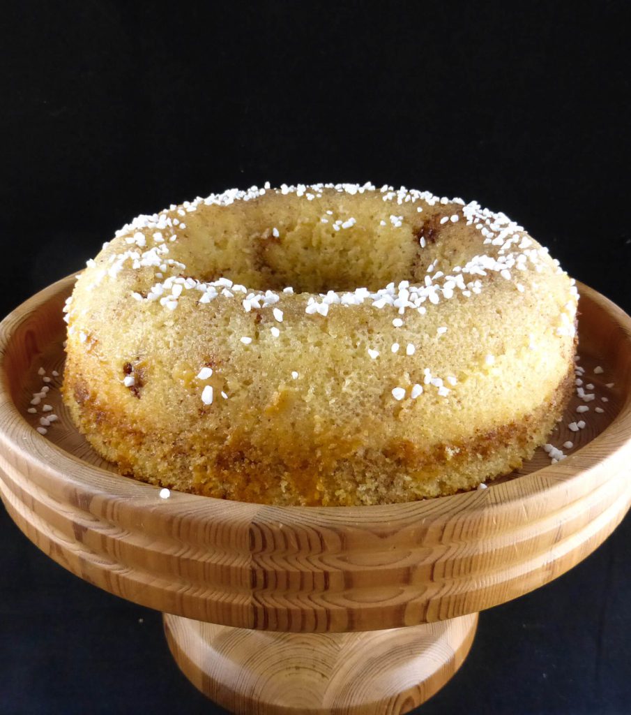 picture of a round sugar cake with two slices cut out