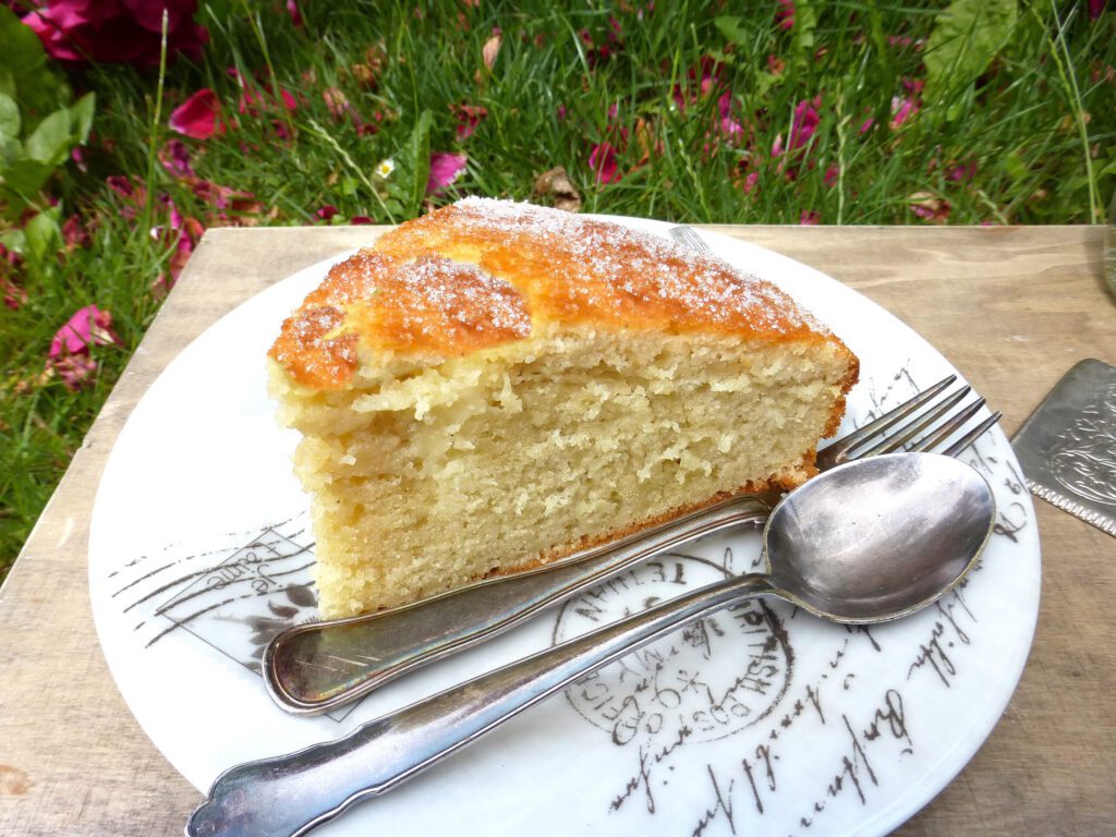 picture of a slice of cake with a spoon and fork by the side