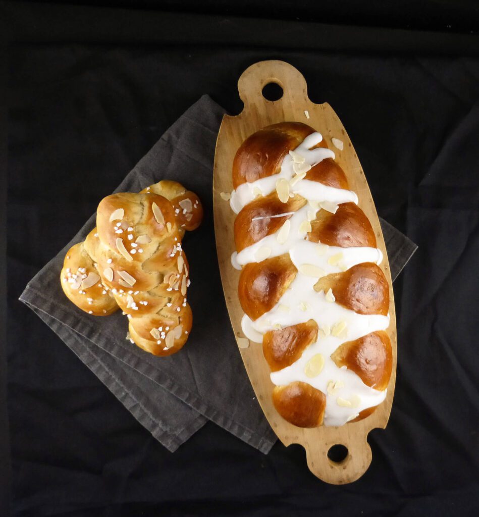 picture of a large loaf and two small plaits of cardamom bread