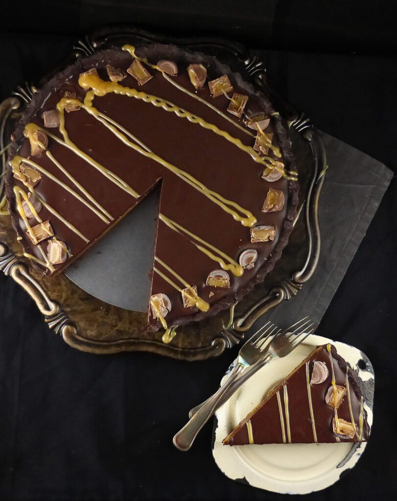 a picture of a chocolate pie with a slice missing