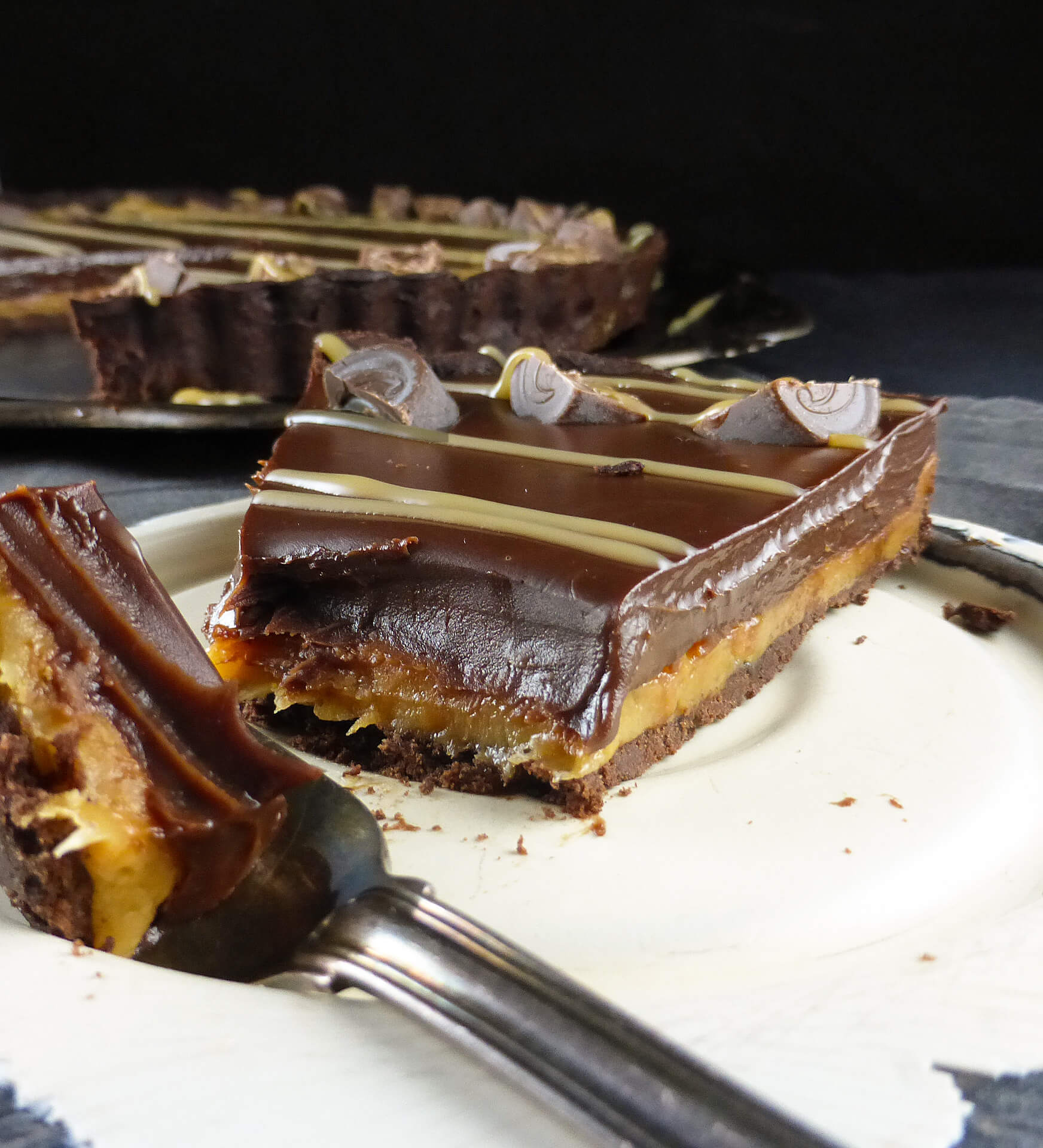 a close up of a chocolate caramel pie