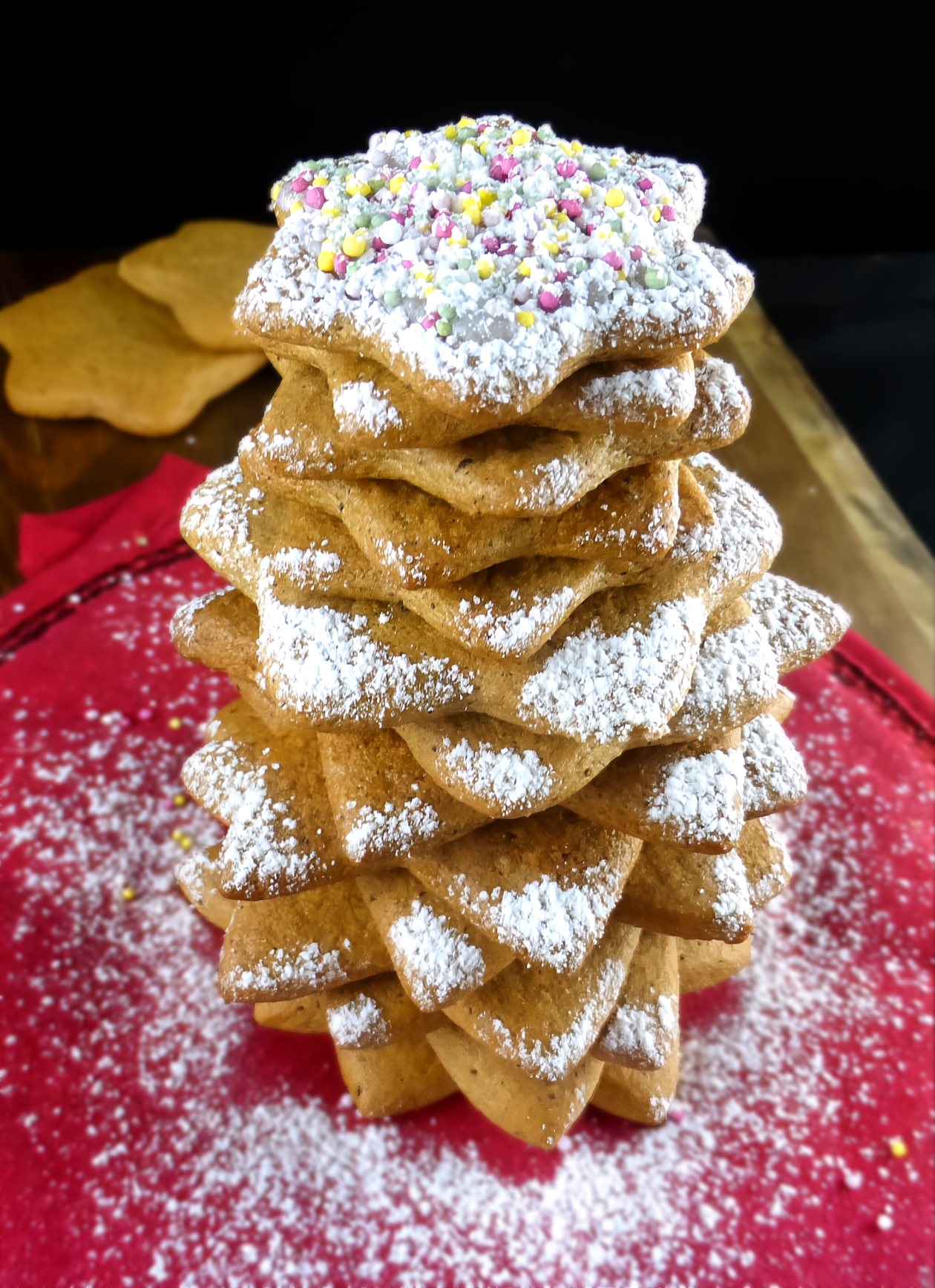 Swedish pepparkakor gingerbread cookies in a star shape stacked on top of each other to form a Christmas tree