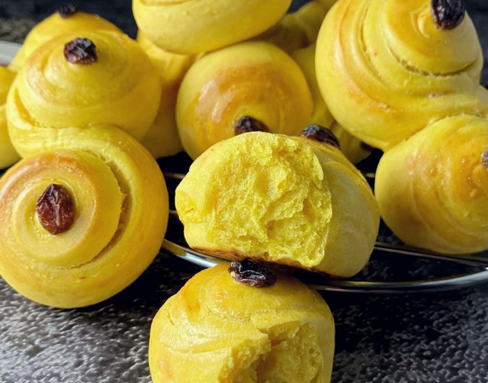 Swedish yellow saffron buns on a slate surface