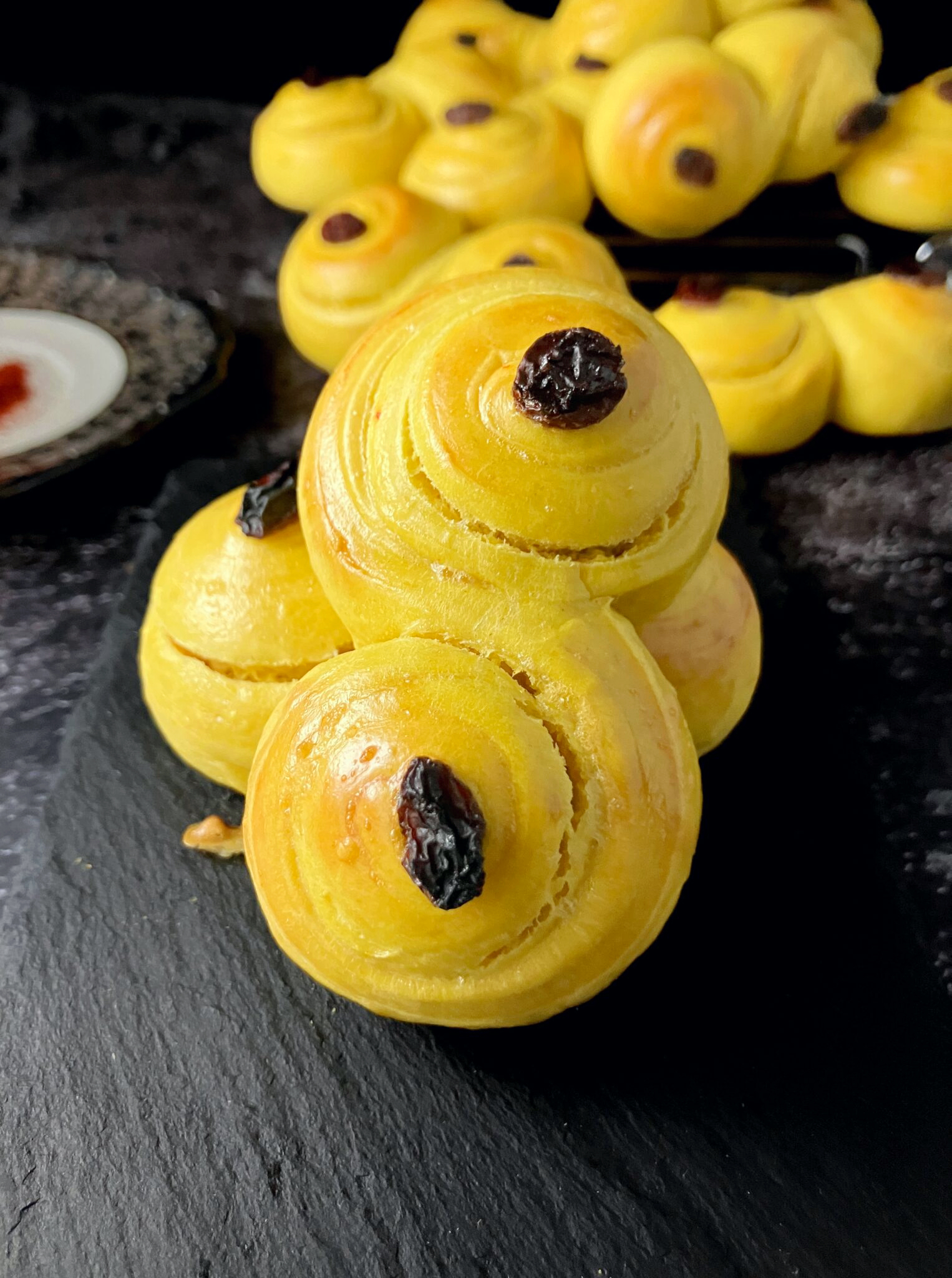 Swedish yellow saffron buns on a slate surface