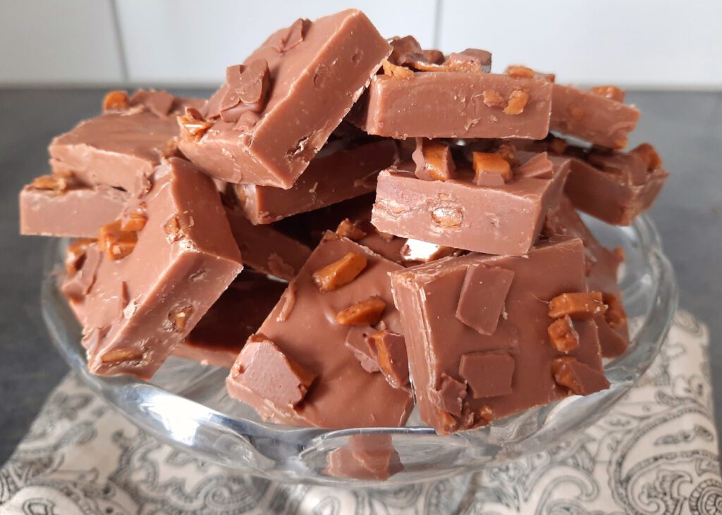 close up of chocolate fudge pieces piled up