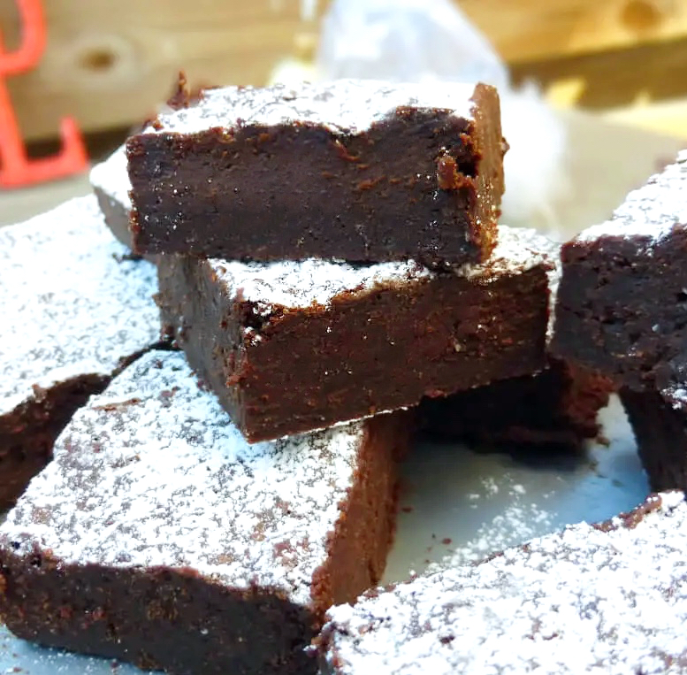 Side view of festive, fudgy brownies made with gingerbread spices