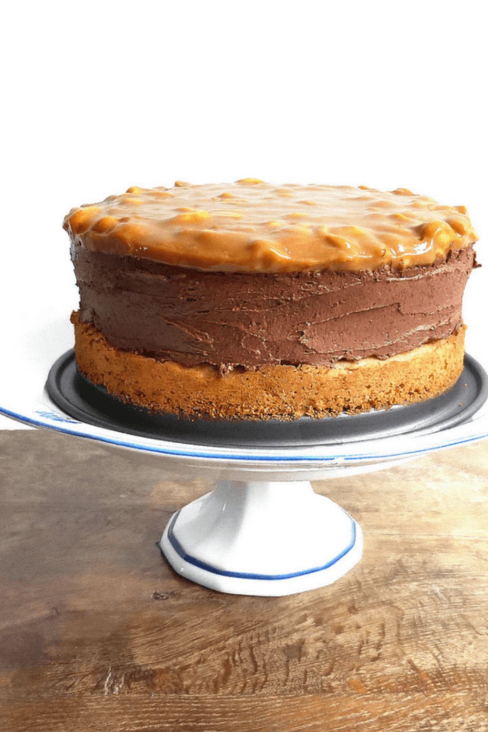 Chocolate Cheesecake with a Peanut Butter Cake Crust (and Salted Peanut Dulce de Leche Topping)