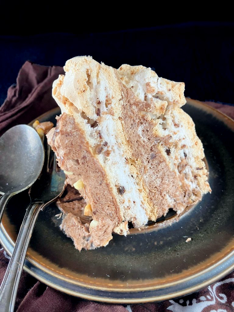 Front view of a double meringue dessert filled with Nutella and hazelnut cream