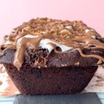 Chocolate cake with melted marshmallow swirls and softened cookie crumbs blending into the crumb