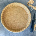 Overhead shot of an empty pastry crust made with olive oil and wholegrain spelt flour