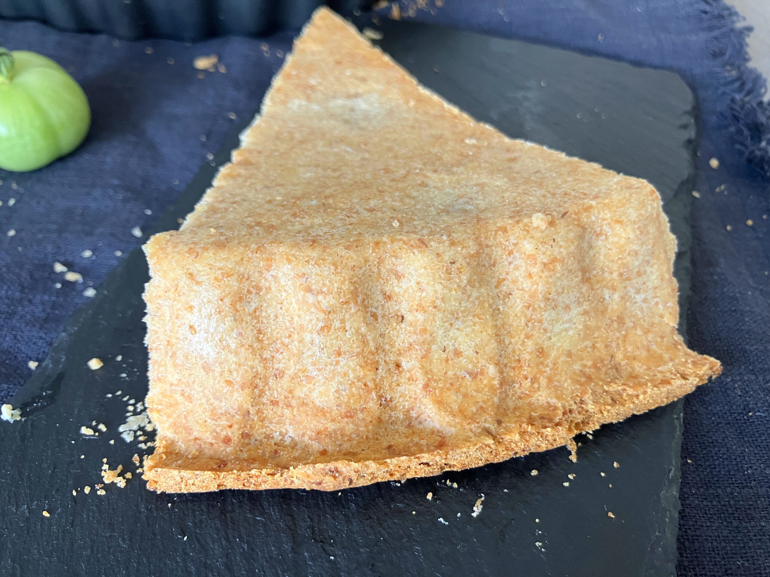 View of a pastry slice upside down to show the crispiness of the crust
