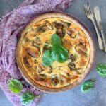 Overhead shot of a spelt flour and olive oil crust quiche filled with cottage cheese and Greek yoghurt.